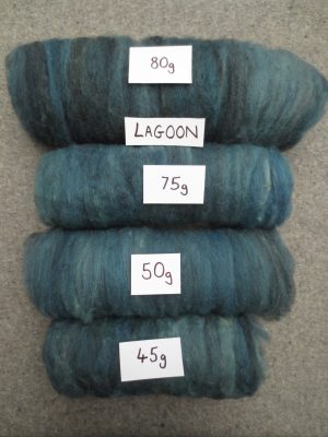 Four rolls of greenish blue carded wool with 85g, 75g, 50g and 45g signs and label named Lagoon