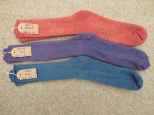 3 pairs of socks labelled dusty cedar, skipper blue and china blue