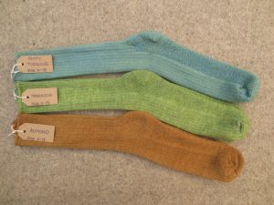 3 pairs of socks labelled dusty turquoise, tarragon, almond