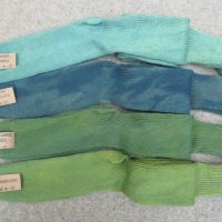 4 pairs of welly boot socks labelled mineral green, tie dye gobelin, artichoke green and tarragon