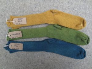 3 pairs of wool socks labelled bright gold, mosstone, indian teal
