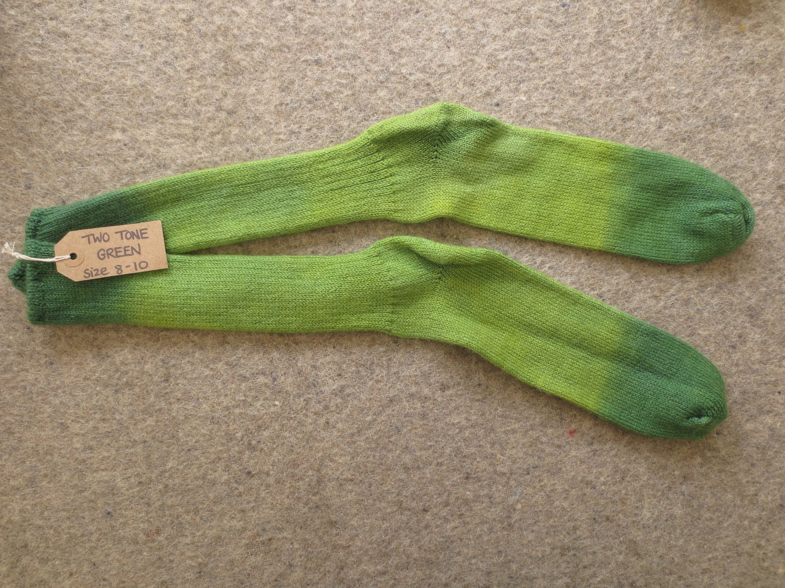 One pair of socks labelled Two Tone Green