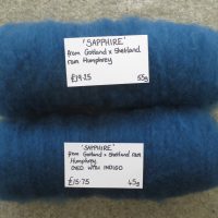 2 rolled batts of blue carded wool