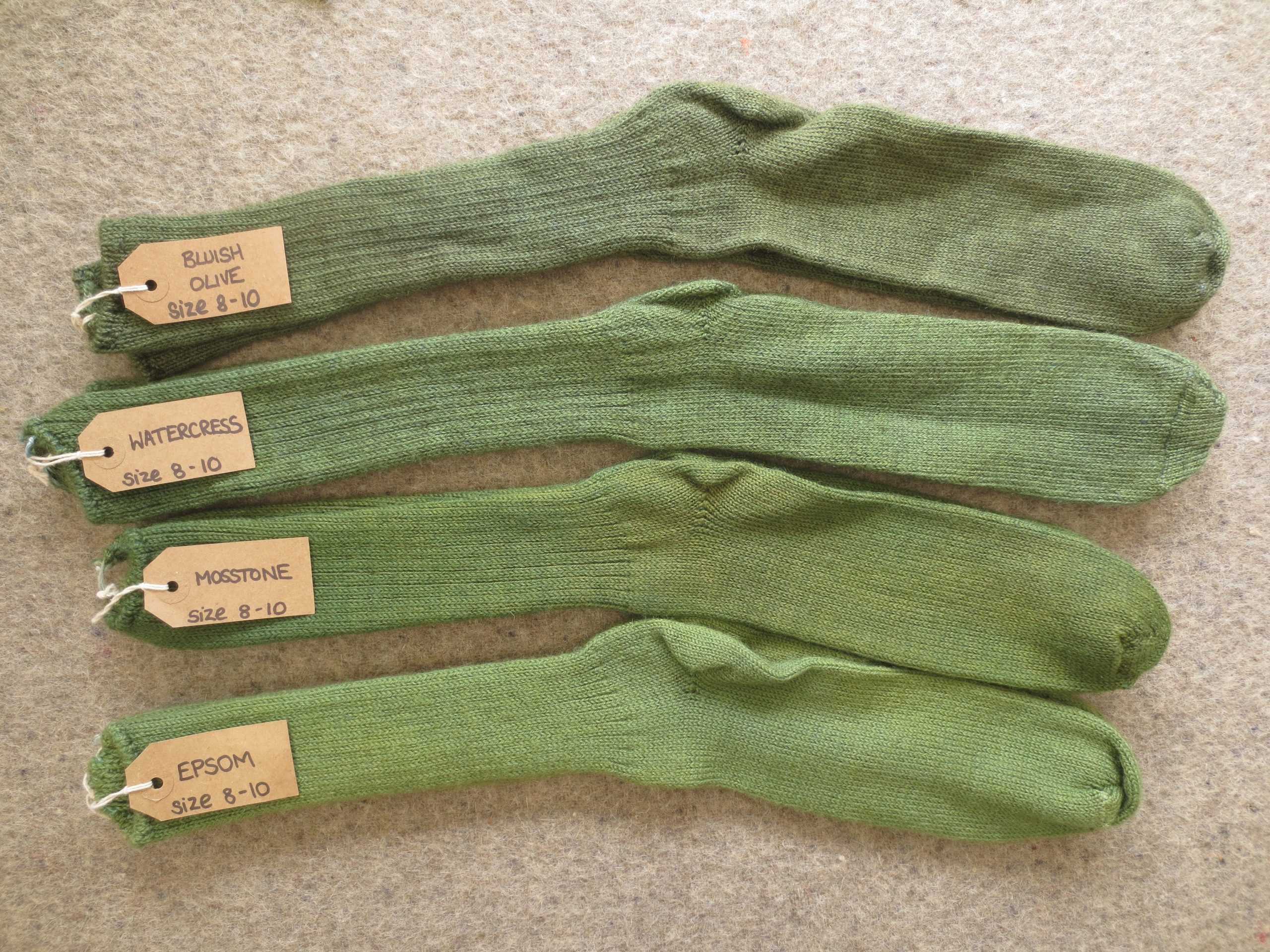 4 pairs of socks labelled Bluish Olive, Watercress, Mosstone and Epsom