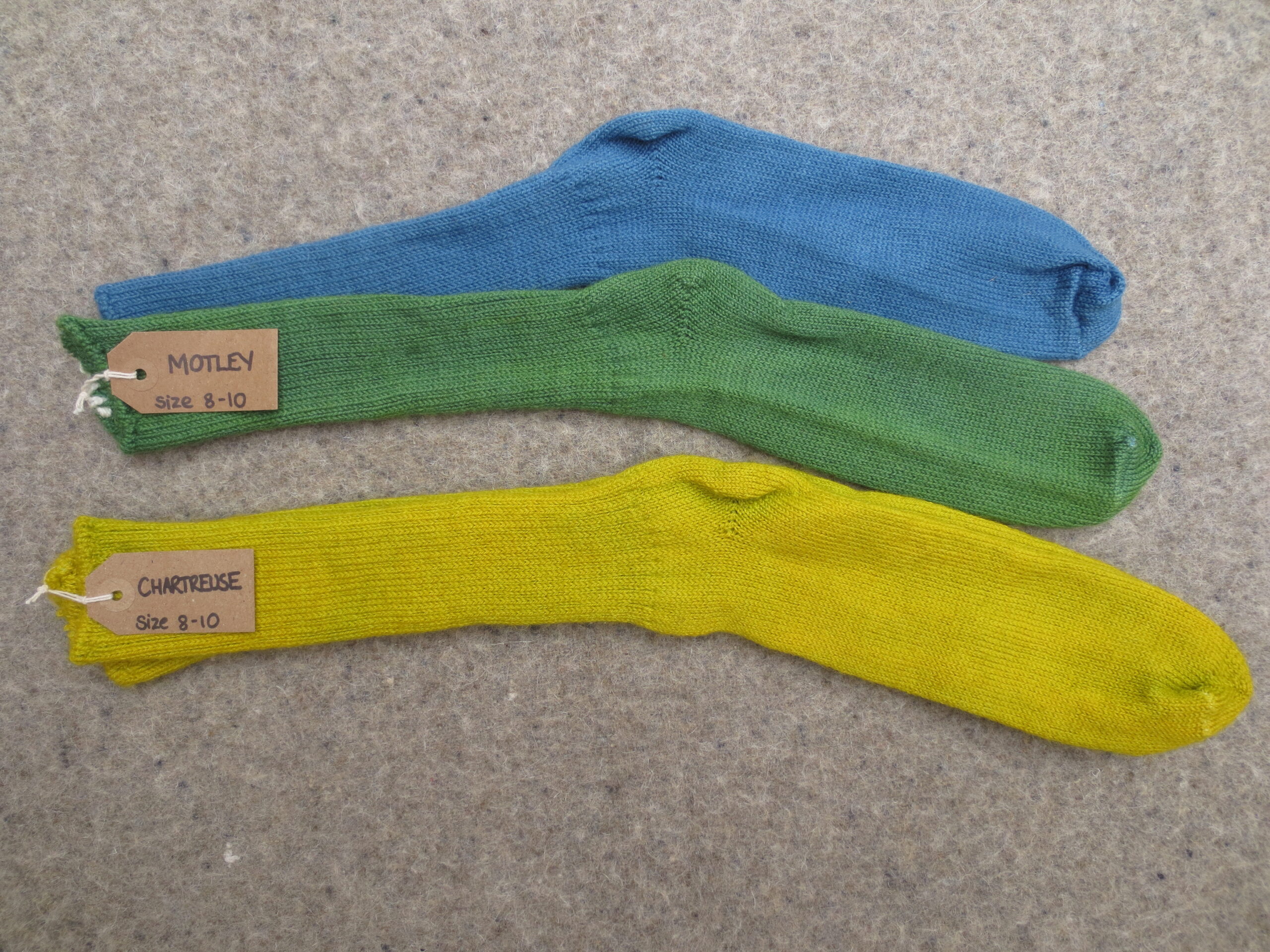 2 pairs of socks labelled Motley and Chartreuse